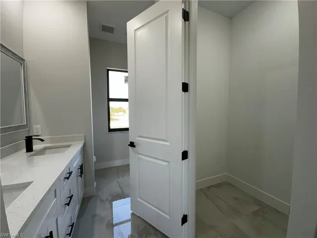 Bathroom with vanity and toilet