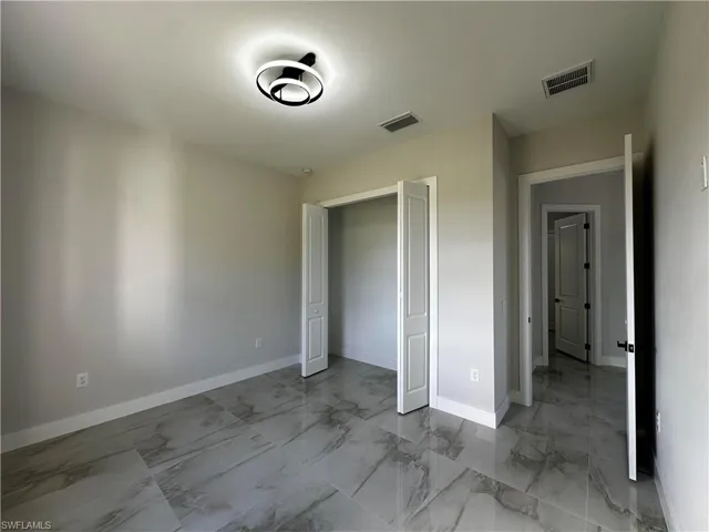 Unfurnished bedroom featuring a closet