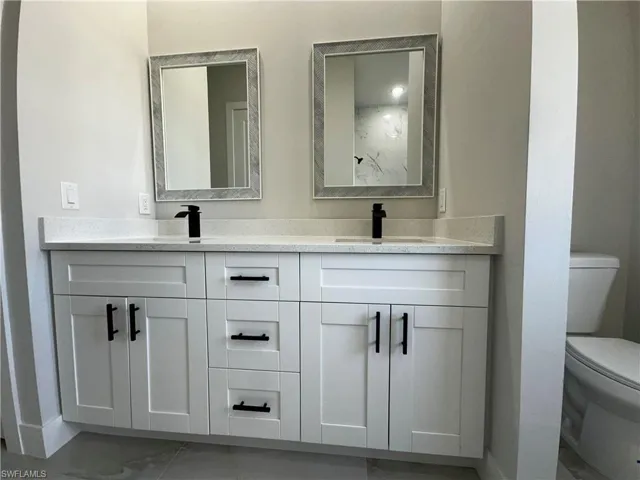 Bathroom featuring vanity and toilet