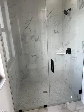 Bathroom with a shower with shower door