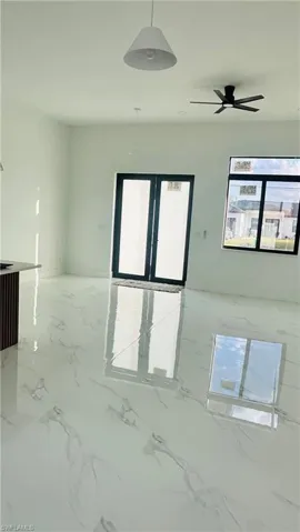 Spare room featuring a ceiling fan