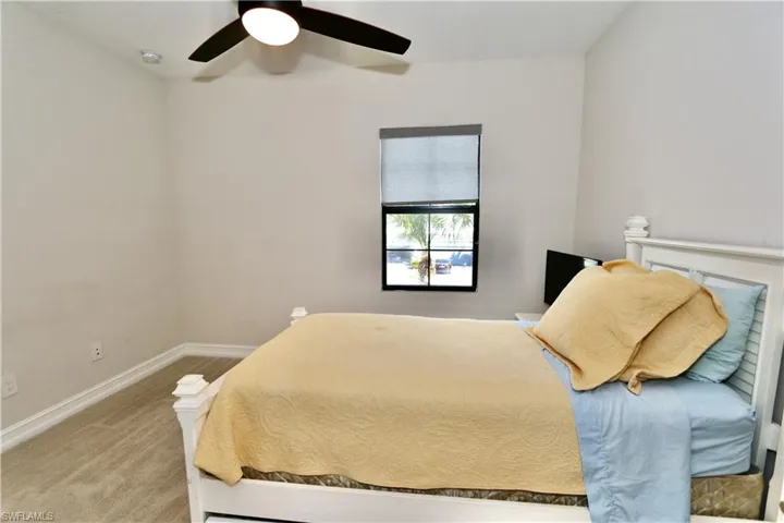Bedroom featuring carpet floors and ceiling fan