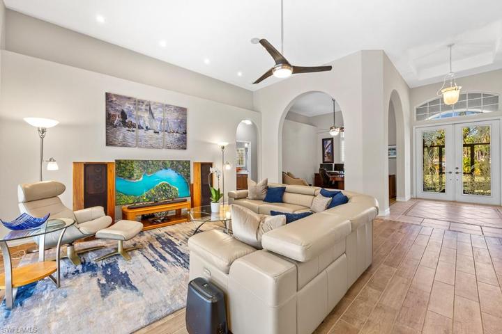 High ceilings and open feel! This beautiful living set does convey with purchase.