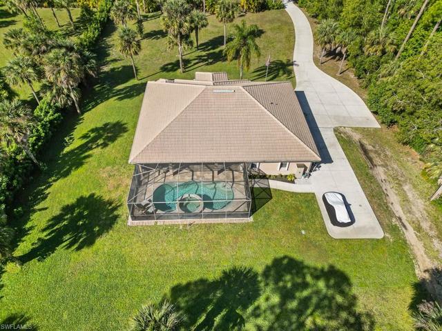 Cement tile roof, and rv parking to the right of the home