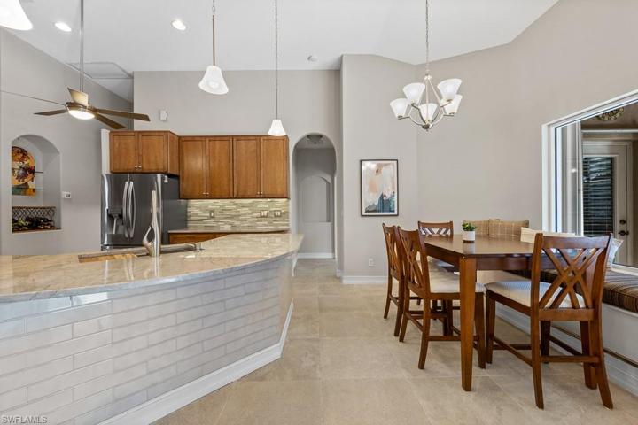 Breakfast bar and eat in area. Note the backsplash under the bar, easy to clean!