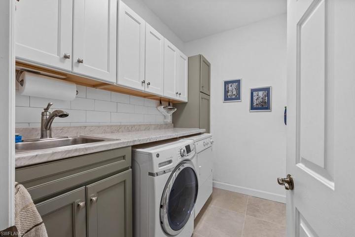 Updated laundry room! New countertops, and lots of storage area, tub sink as well.