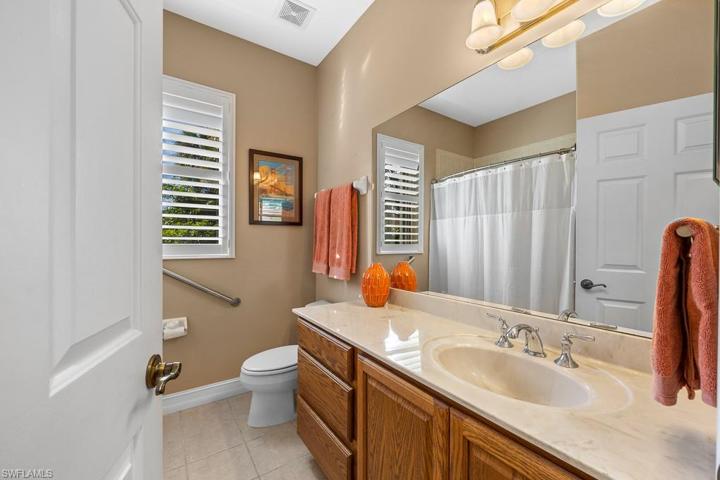 Guest bathroom with tub shower.