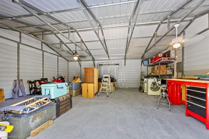 Inside the garage/workshop. Three roll up doors and electricity
