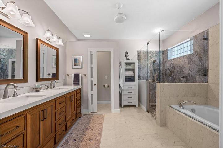 Owner bathroom completely renovated! New granite countertops, teak cabinets, private watering closet, new shower with waterfall effect tile!