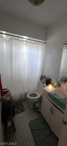 Bathroom with vanity and toilet