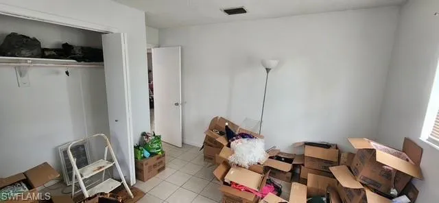 Bedroom with closet and windows