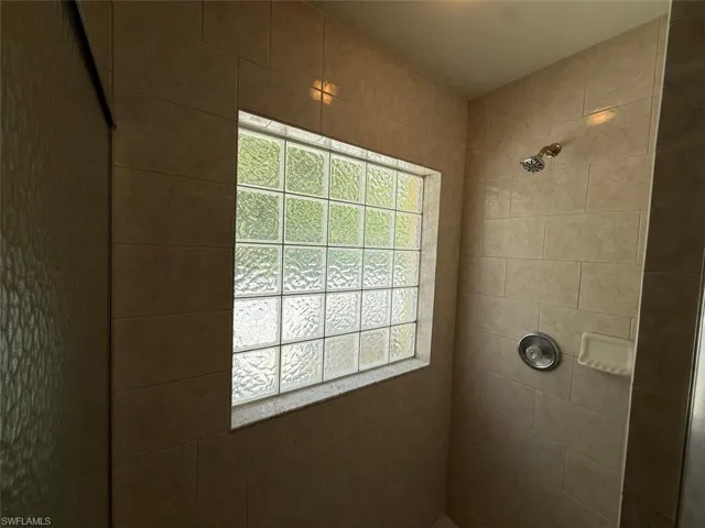 Full bathroom with tiled shower