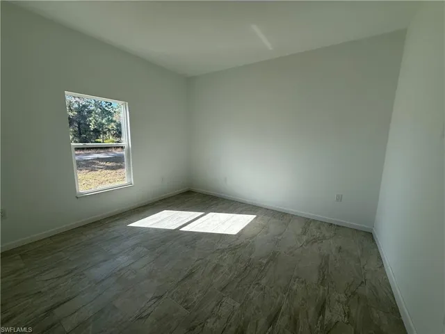 Empty room with baseboards