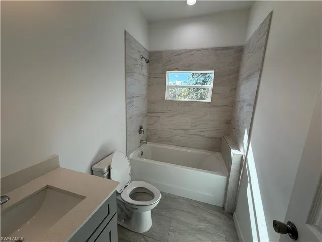 Full bathroom featuring vanity and bathtub / shower combination