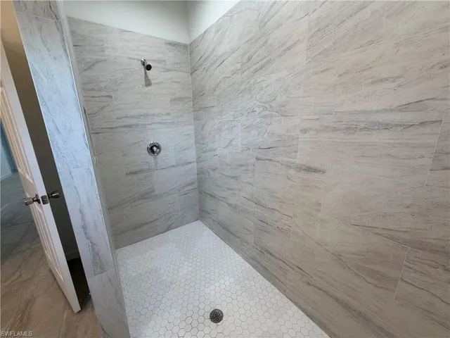 Bathroom with a tile shower