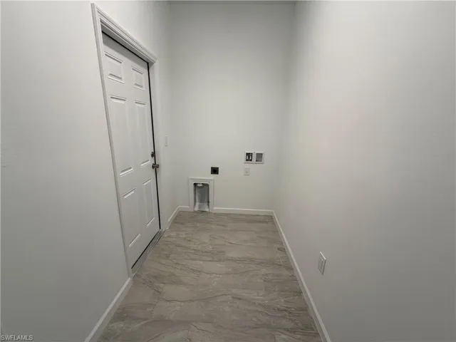 Washroom featuring electric dryer hookup and hookup for a washing machine