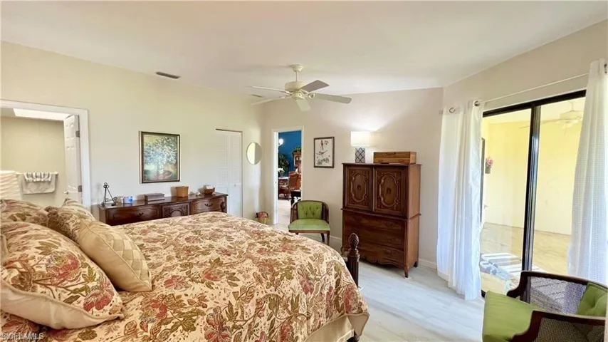 Bedroom with access to outside and ceiling fan