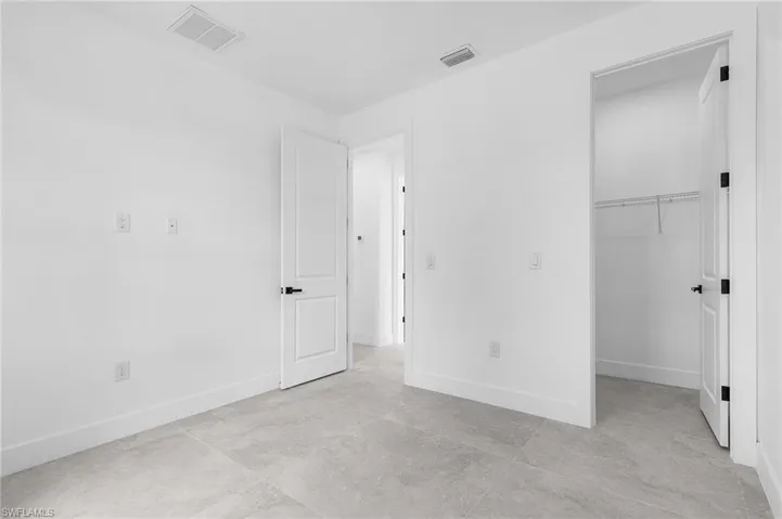 Unfurnished bedroom featuring a closet