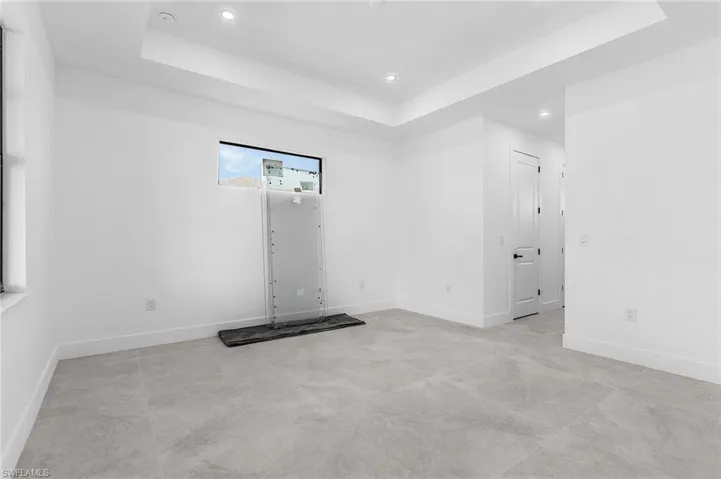 Spare room with a tray ceiling