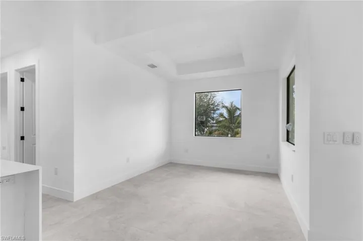 Spare room with a tray ceiling