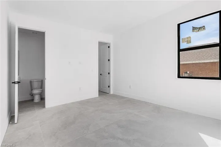 Unfurnished bedroom with ensuite bath