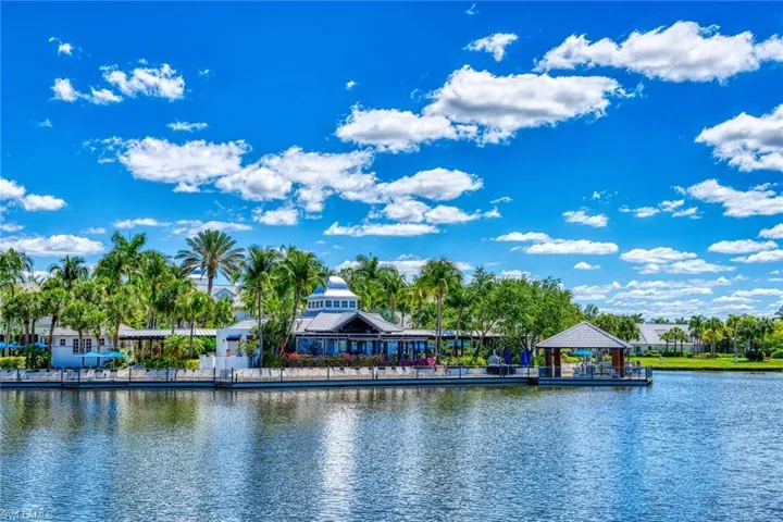Long View of the Club & Spa from Fiddlers Creek Parkway.  IMPRESSIVE!  The expansive board walk and the covered deck to the right host many Dining and Dancing events like the Annual Food & Wine Tasting Event.  Chefs from some of the Very Best Restaurants make this event SPECIAL!