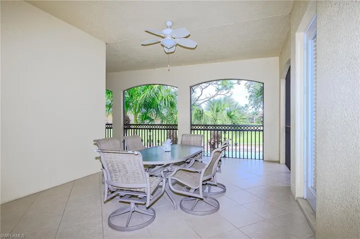 LARGE fashionable Lanai .  Pleasant for Coffee Reading and DRINKS!  Overlooks a lake and golf course.  Faces East - Cheery mornings and pleasant shaded afternoon.