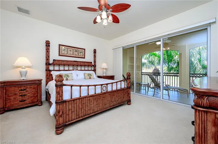 Master Bedroom opens to the Lanai which overlook a lake and gold course.  Vertical Blinds provide privacy
