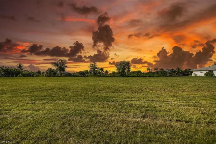 Yard at dusk with a rural view