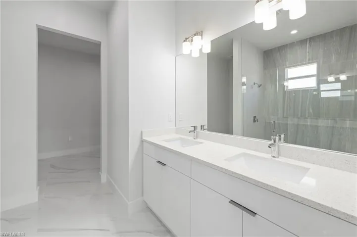 Modern vanity with dual undermount sinks and white quartz countertop