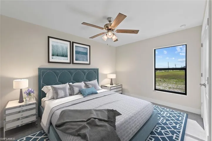 Bedroom with baseboards and ceiling fan