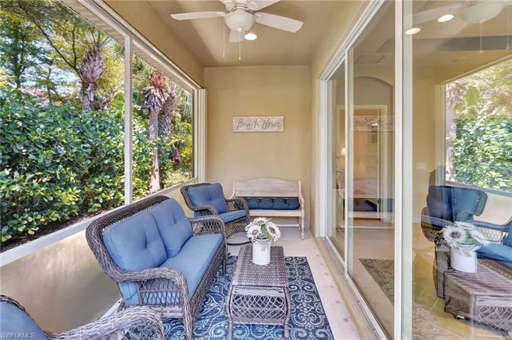 Sunroom featuring outdoor lounge area, ceiling fan, and plenty of natural light