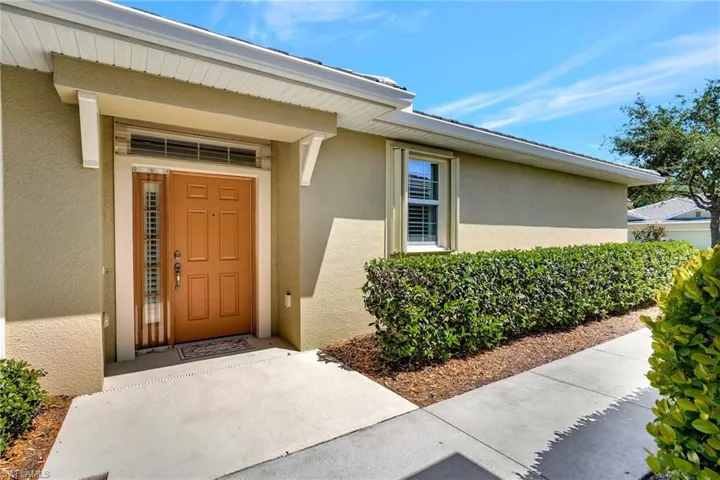 View of exterior entry with stucco siding