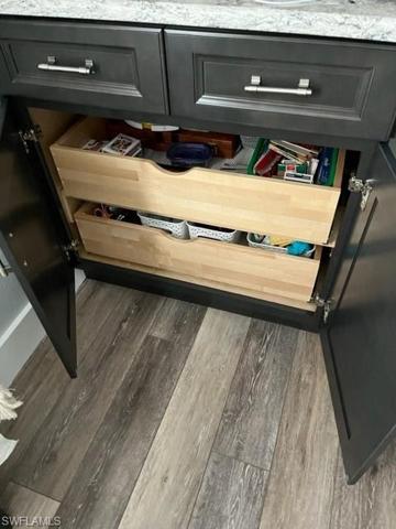 Office lower cabinets have pull out shelves