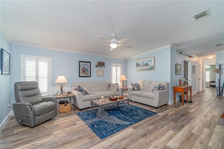 Living room from master bedroom door. Office and hallway to front of home at right