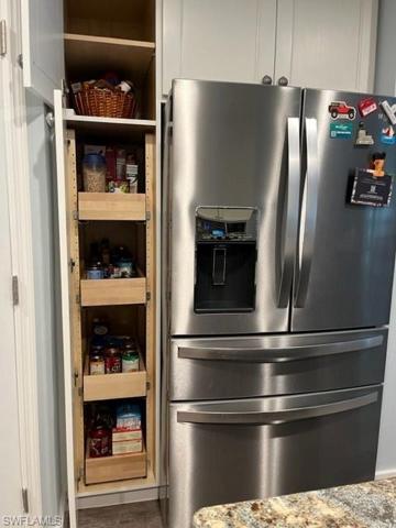 Pantry next to the refrigerator