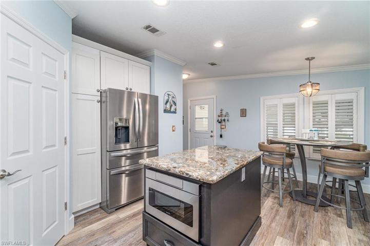 Kitchen from stove area. Note drawer microwave