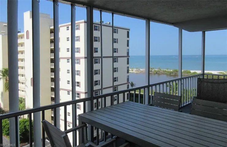 Sunroom / balcony featuring plenty of natural light and a water view