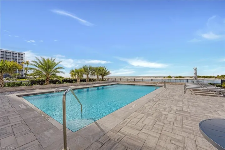 Community pool with a patio area
