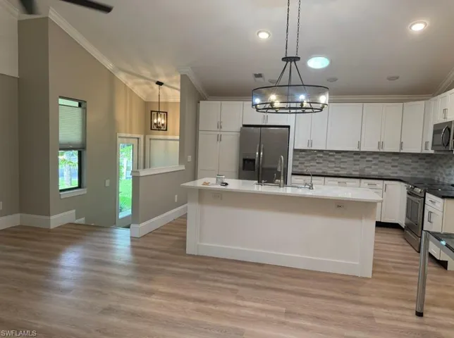 Foyer with Front Side Door and door to the garage