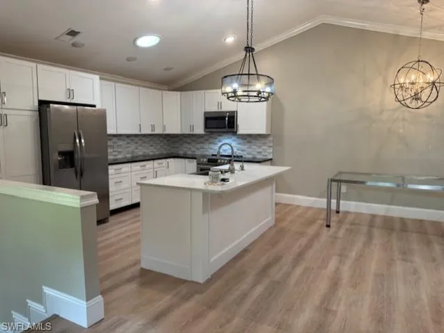 Kitchen Showing dining area and  Designer lighting