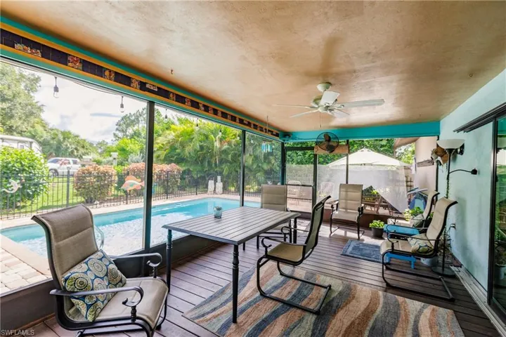 Sunroom featuring ceiling fan