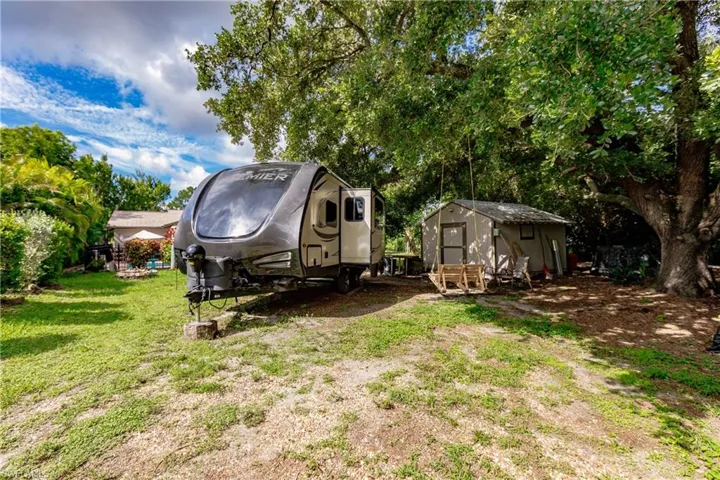 View of yard with a storage shed