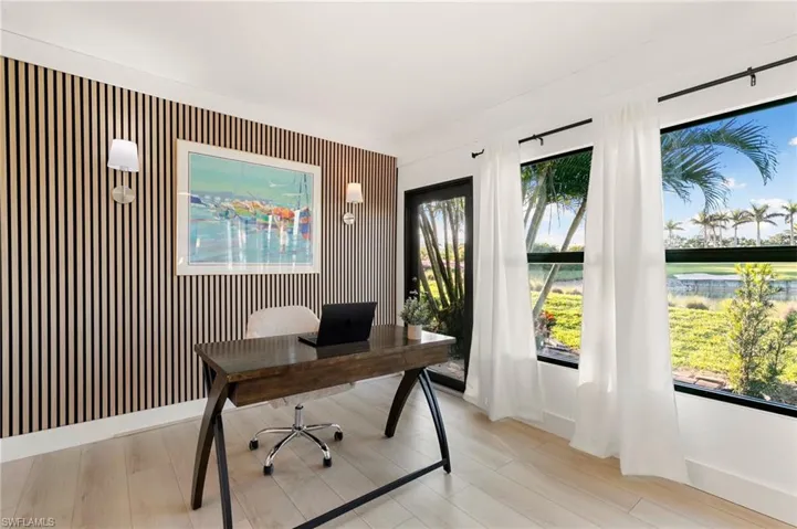 Office space featuring baseboards and a healthy amount of sunlight