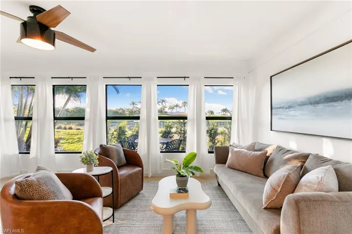 Sunroom with a ceiling fan