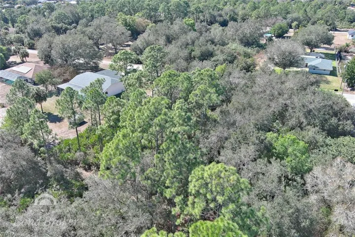Aerial overview of property's location with a forest