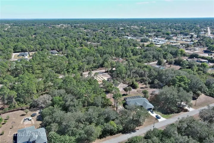 View of property location featuring a heavily wooded area