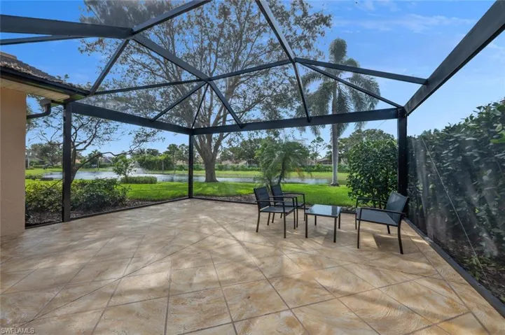 View of patio / terrace with a water view and a lanai