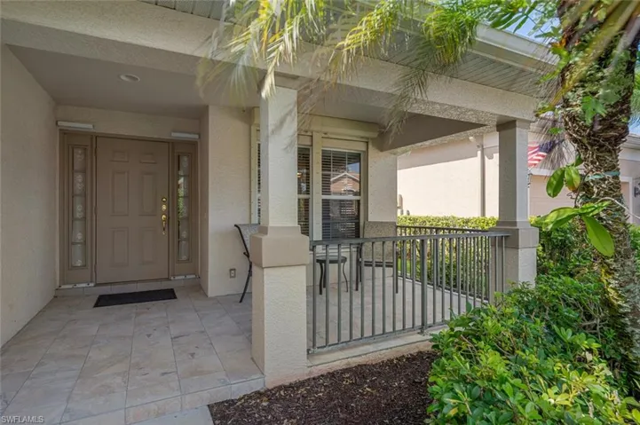 View of exterior entry with a porch