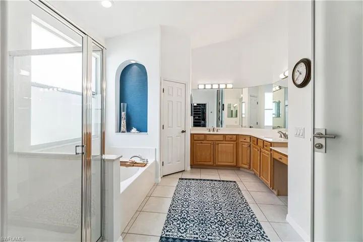 Oversized en-suite bath with large tub, walk-in shower, dual vanities & separate water closet